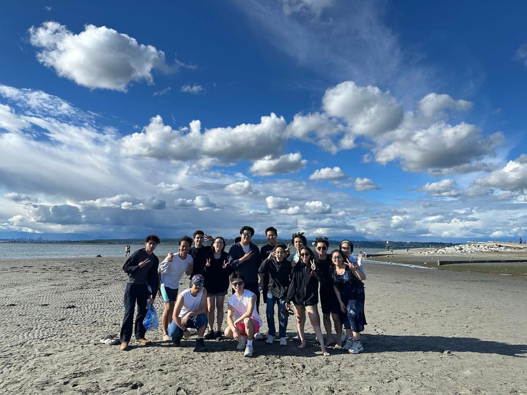 Friends posing together on a beach